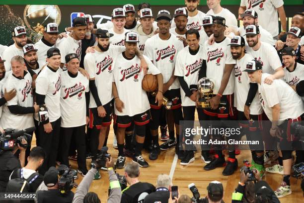 The Miami Heat pose with the Bob Cousy Trophy after defeating the Boston Celtics 103-84 in game seven of the Eastern Conference Finals at TD Garden...
