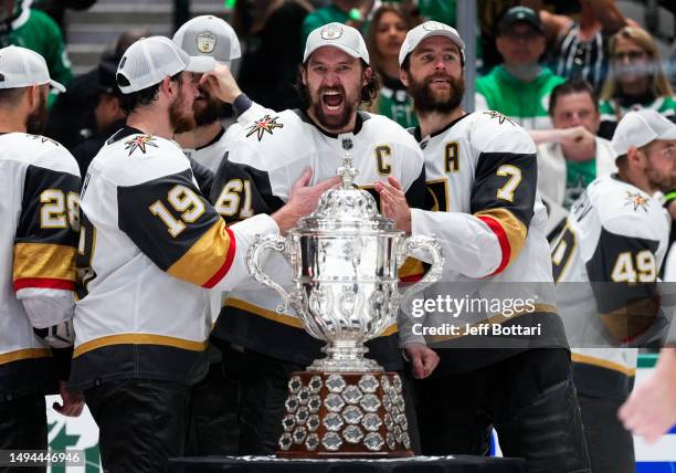 Mark Stone, Reilly Smith, and Alex Pietrangelo of the Vegas Golden Knights pose with the Clarence S. Campbell Bowl after a 6-0 victory against the...