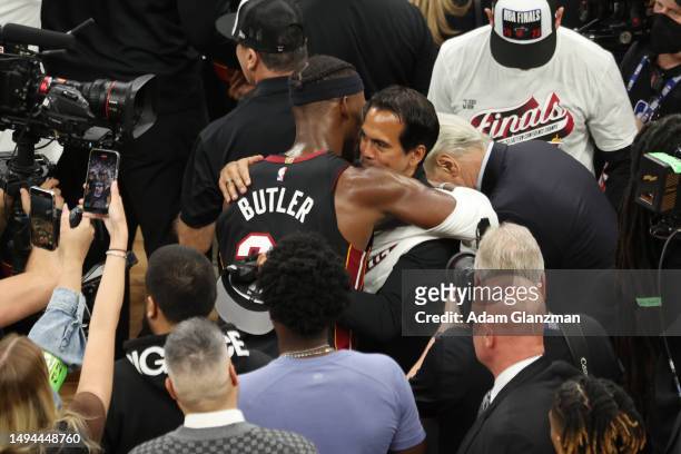 Jimmy Butler of the Miami Heat hugs head coach Erik Spoelstra after defeating the Boston Celtics 103-84 in game seven of the Eastern Conference...
