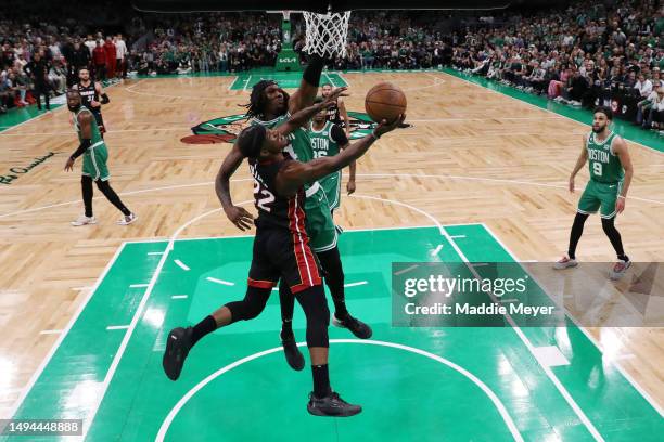 Jimmy Butler of the Miami Heat shoots the ball against Robert Williams III of the Boston Celtics during the third quarter in game seven of the...
