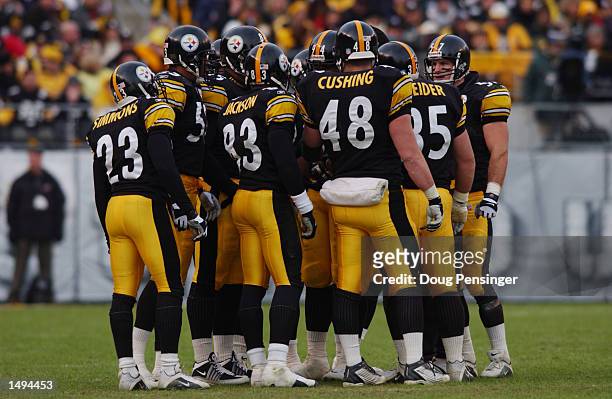 Linebacker John Fiala of the Pittsburgh Steelers huddles with teammates during the AFC divisional playoff game against the Baltimore Ravens at Heinz...