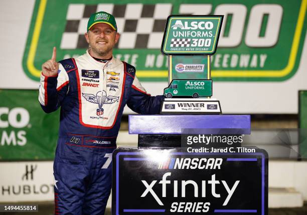 Justin Allgaier, driver of the Unilever Military DeCA RCPT Chevrolet, celebrates in victory lane after winning the NASCAR Xfinity Series Alsco...