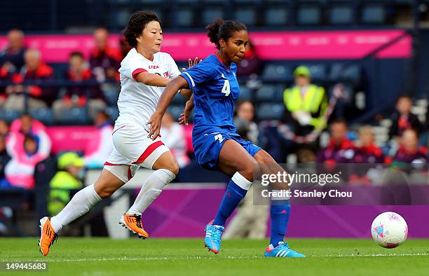 Laura Georges of France holds off Choe Mi Gyong of DPR Korea during the Women's Football first round Group G match between France and DPR Korea on...