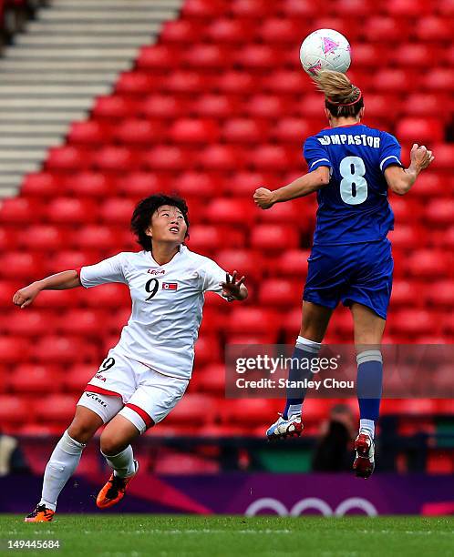 Choe Mi Gyong of DPR Korea in action with Sonia Bompastor of France during the Women's Football first round Group G match between France and DPR...