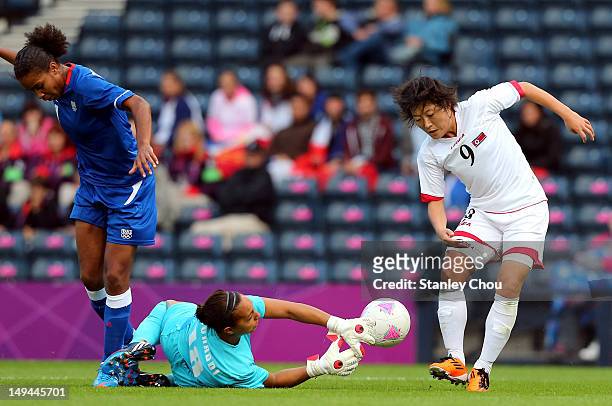 Choe Mi Gyong of DPR Korea in action with Sarah Bouhaddi of France during the Women's Football first round Group G match between France and DPR Korea...