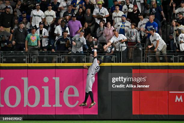 Aaron Judge of the New York Yankees catches the ball at the wall during the eighth inning against the Seattle Mariners at T-Mobile Park on May 29,...