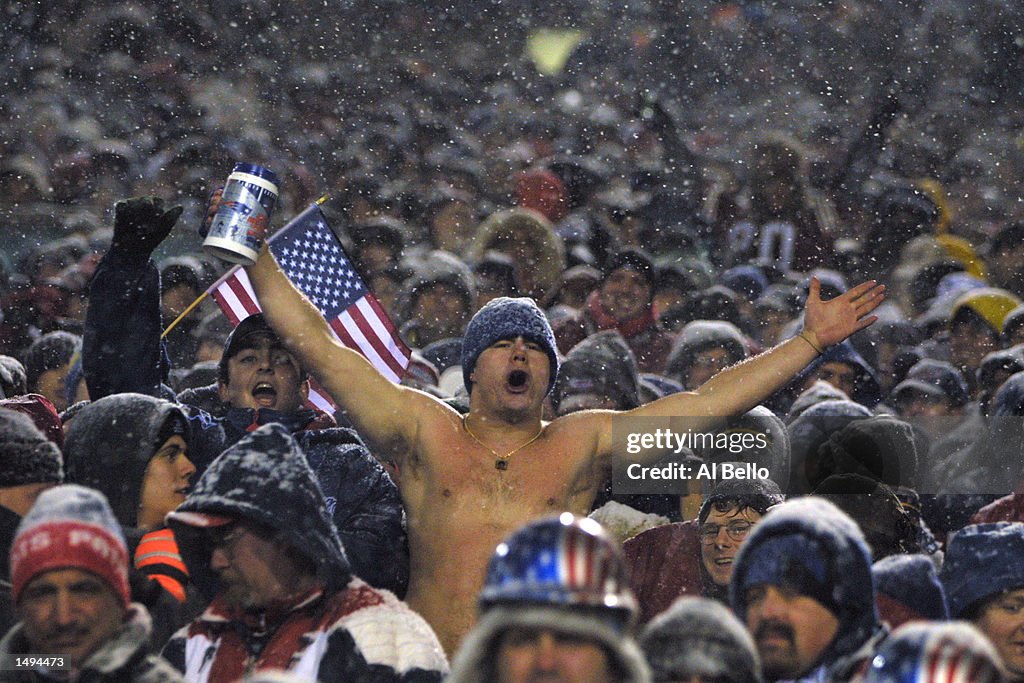 19 Jan 2002:   A New England Patriots fan cheers for the team during the AFC playoff game against th