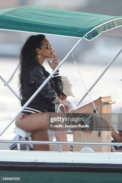 Rihanna is seen smoking a cigarette on a boat on July 28, 2012 in Portofino, Italy.