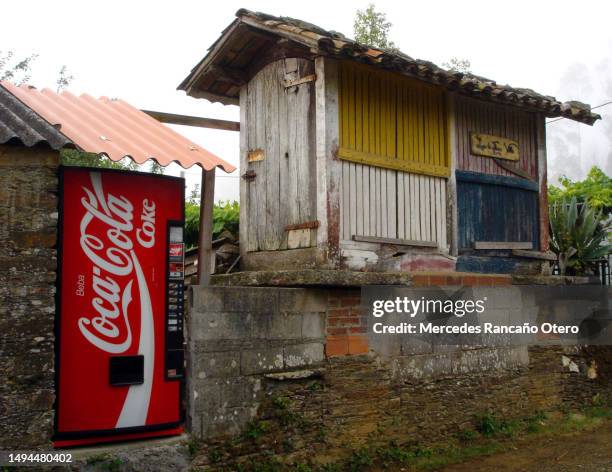 'camino de santiago', galicia, spain. hórreo with coke vending machine. - pepsi centre stock pictures, royalty-free photos & images