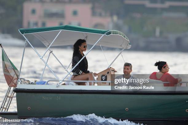 Rihanna is seen driving a boat on July 28, 2012 in Portofino, Italy.