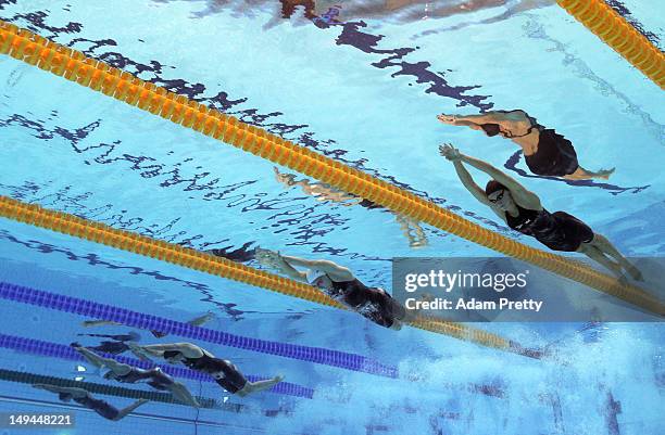 Dana Vollmer of the United State, Alicia Coutts of Australia and Claire Donahue of the United States compete in the second semifinal heat of the...