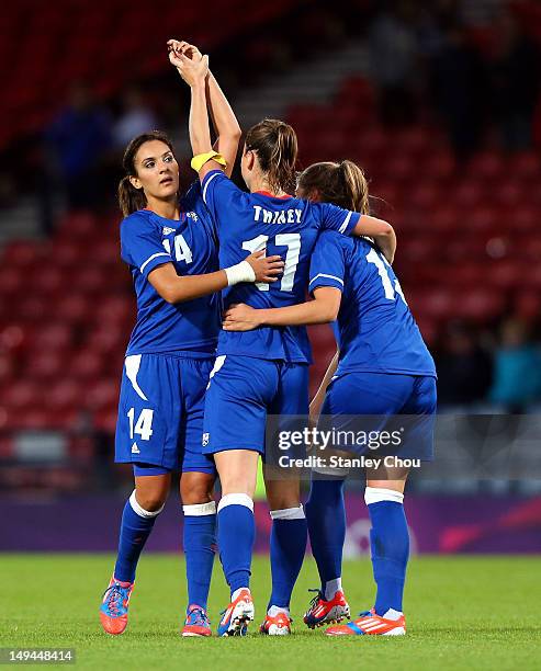 Gaetane Thiney, Louisa Necib and Elodie Thomis of France celebrates after the final whistle during the Women's Football first round Group G match...