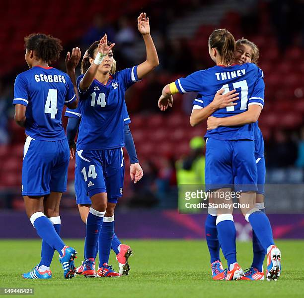 France celebrates after the final whistle during the Women's Football first round Group G match between France and DPR Korea on Day 1 of the London...