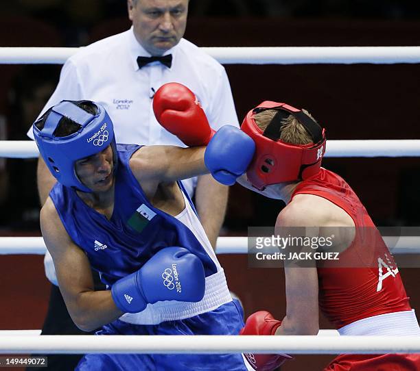 Abdelmalek Rahou of Alergia defends against Jesse Ross of Australia in their first round Middleweight bout of the 2012 London Olympic Games on July...