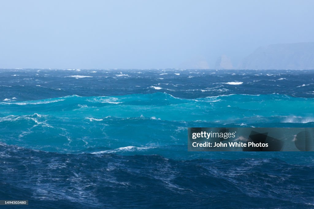 Rough ocean. Stormy conditions. Sun shining on white caps. Southern Ocean. Australia.