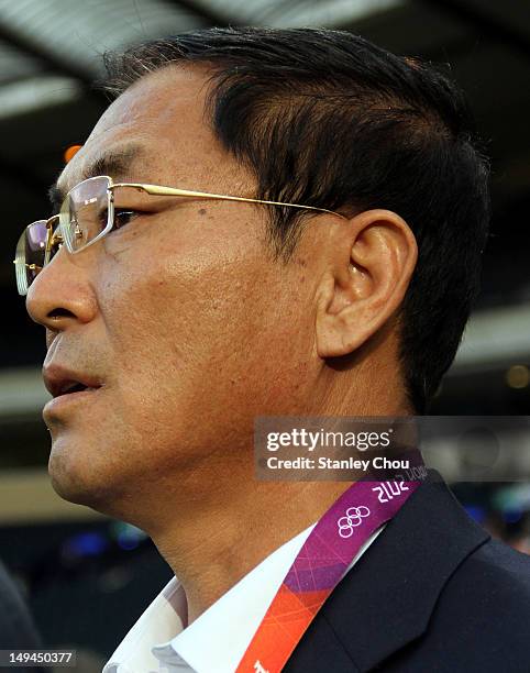 Sin Ui Gun coach of DPR Korea looks on during the Women's Football first round Group G match between France and DPR Korea on Day 1 of the London 2012...