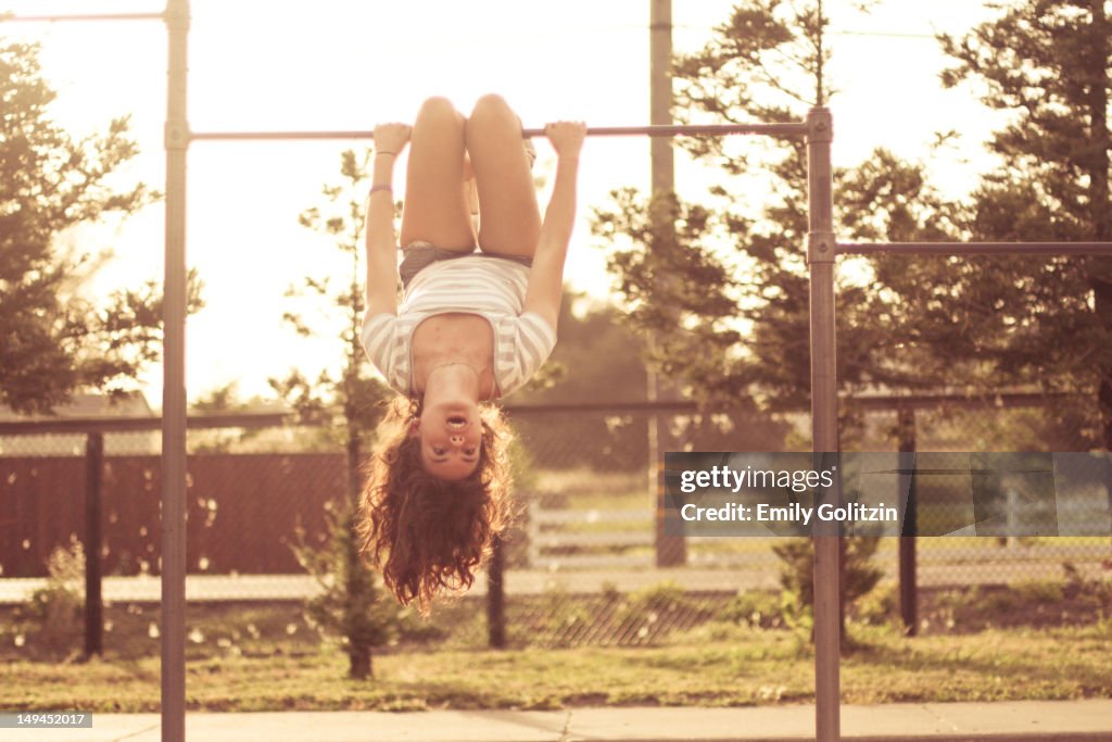 Girl on monkey bars