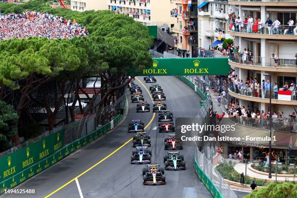 Max Verstappen of the Netherlands driving the Oracle Red Bull Racing RB19 leads Fernando Alonso of Spain driving the Aston Martin AMR23 Mercedes and...