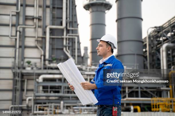 engineer working in power plant. - factory blueprint stock pictures, royalty-free photos & images