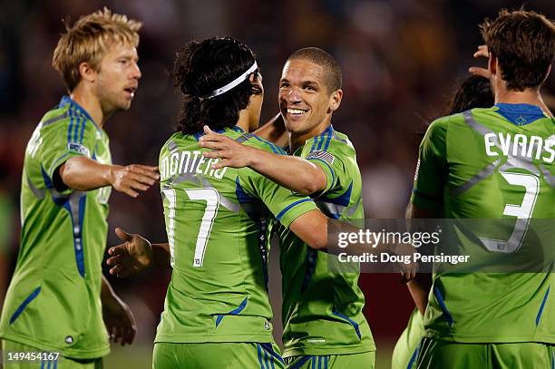 Osvaldo Alonso of the Seattle Sounders FC celebrates his game winning goal in the 65th minute with teammate Fredy Montero of the Seattle Sounders FC...