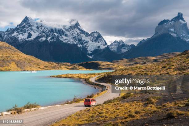 mini van driving in torres del paine national park, chilean patagonia - chile stock pictures, royalty-free photos & images