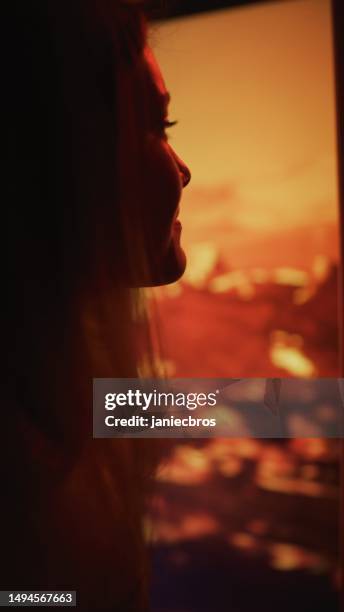 shaky mars rover trip over the surface of red planet mars. close-up female astronaut looking out the window to see barren scenery vertical image - shaky stock pictures, royalty-free photos & images