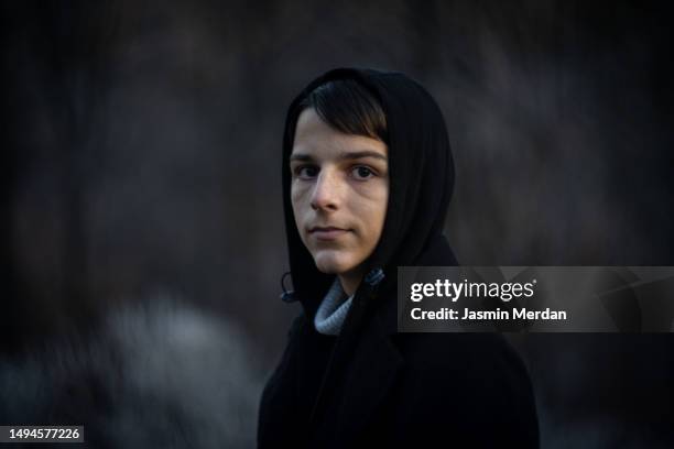 boy in woods with artistic bokeh background - portrait dark background stock pictures, royalty-free photos & images