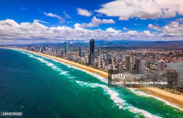 aerial view scene of gold coast sea beach from the sea far away can see surfers paradise skyline, broadbeach, main beach with luxury apartment and hotel high real estate in gold coast - main beach gold coast stock pictures, royalty-free photos & images