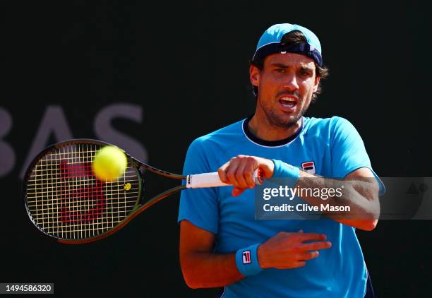 Guido Pella of Argentina plays a forehand against Quentin Halys of France during their Men's Singles First Round Match on Day Three of the 2023...