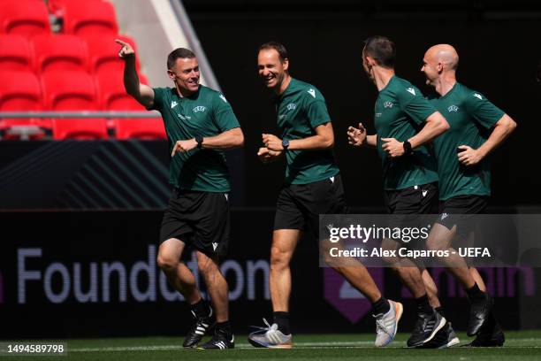 Reserve Assistant Referee Stuart Burt of England, and Assistant Video Assistant Referee 2 Bastian Dankert warm up on the pitch prior to the UEFA...