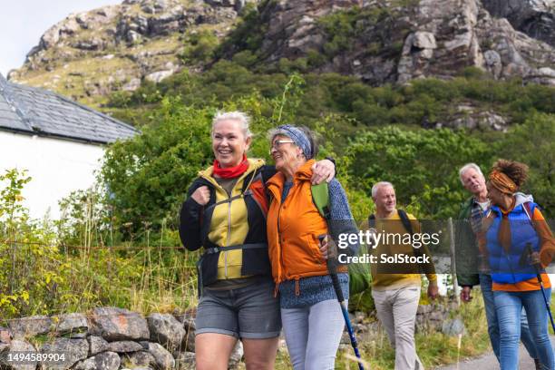 laughing together on a walk - hiking stock pictures, royalty-free photos & images