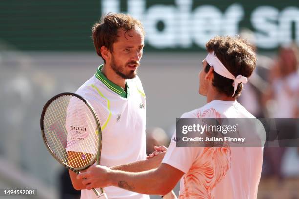 Daniil Medvedev shakes hands with Thiago Seyboth Wild of Brazil after their Men's Singles First Round Match on Day Three of the 2023 French Open at...