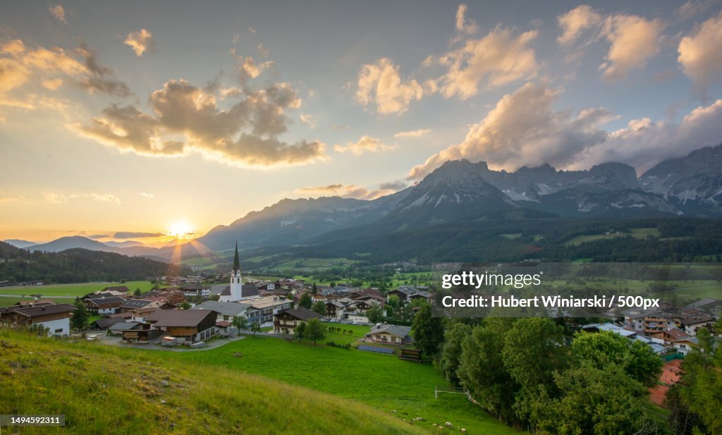 Scenic view of townscape and mountains against sky,Ellmau,Austria