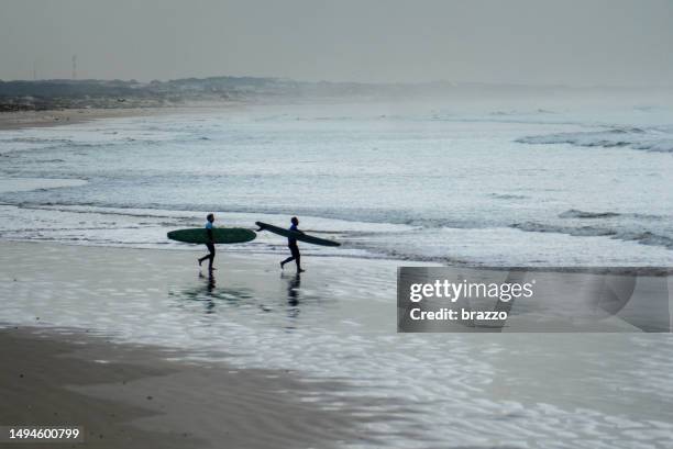 surfers prepare - false bay stock pictures, royalty-free photos & images