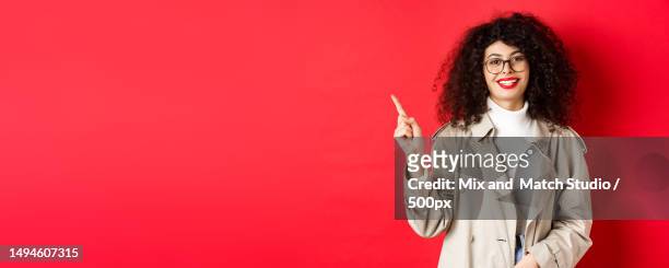 portrait of stylish caucasian woman in trench coat and glasses - trench mouth stock pictures, royalty-free photos & images