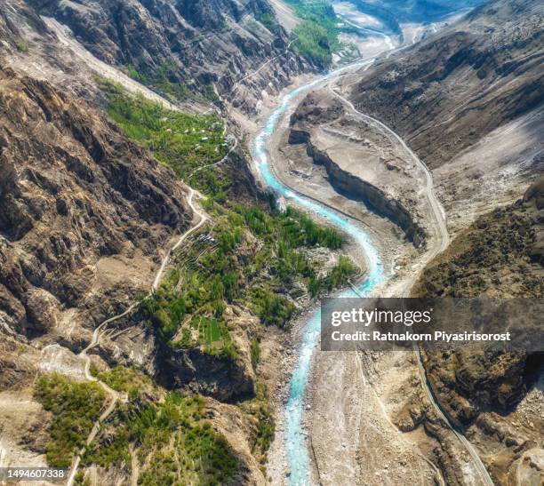 aerial drone sunrise scene of landscape of hunza valley with river and karakoram range mountain, hunza valley, gilgit-baltistan, north of pakistan. - asia village river bildbanksfoton och bilder