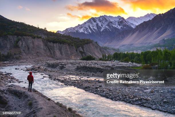 sunset scene landscape of hunza valley with river and karakoram range mountain, hunza valley, gilgit-baltistan, north of pakistan. - karimabad hunza stock pictures, royalty-free photos & images