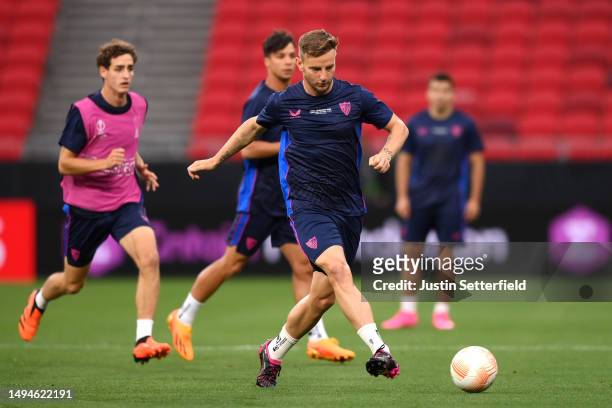 Ivan Rakitic of Sevilla FC passes the ball during a training session prior to the UEFA Europa League 2022/23 final match between Sevilla FC and AS...