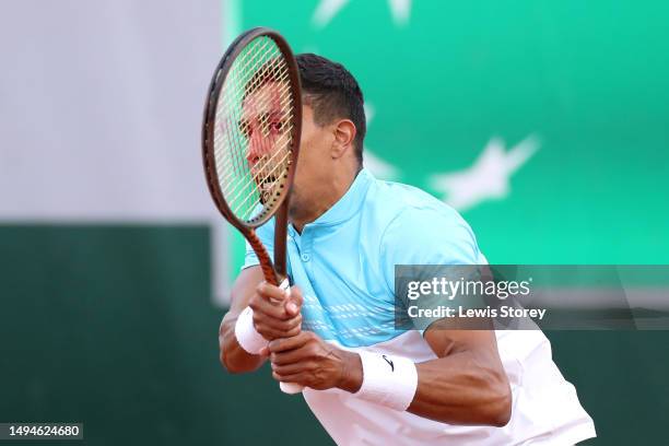 Thiago Monteiro of Brazil plays a backhand against Yannick Hanfmann of Germany during their Men's Singles First Round Match on Day Three of the 2023...