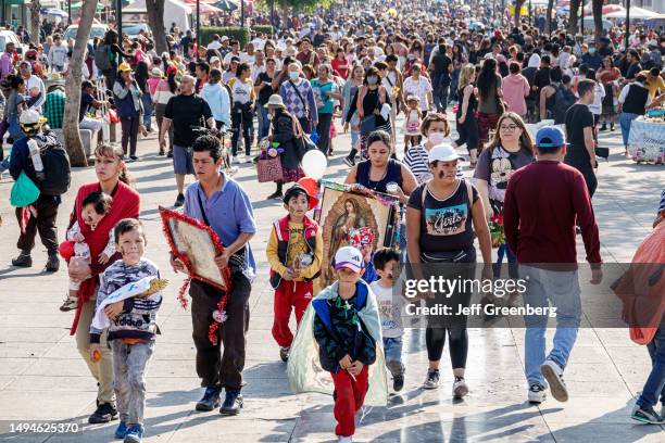 Mexico City, Mexico, Day of the Virgin of Guadalupe, Plaza Mariana Avenida Montevideo, crowds of pilgrims entering Basilica of Santa Maria de...