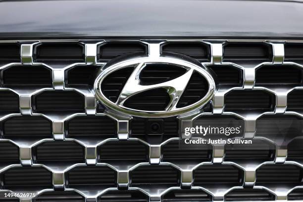 The Hyundai logo is displayed on a new car on the sales lot at San Leandro Hyundai on May 30, 2023 in San Leandro, California. A surge in Kia and...