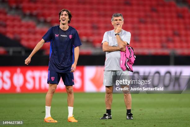 Bryan Gil and Jose Luis Mendilibar, Head Coach of Sevilla FC, look on during a training session prior to the UEFA Europa League 2022/23 final match...