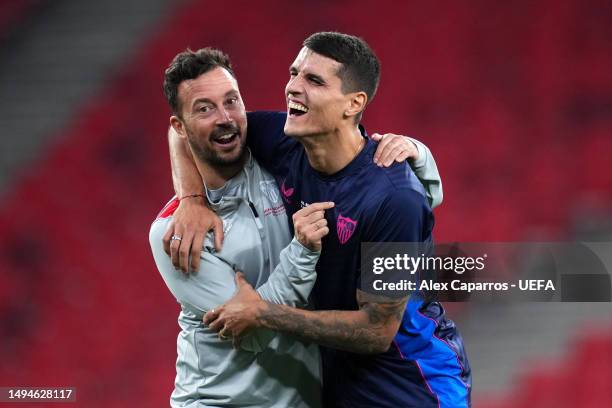 Erik Lamela of Sevilla FC reacts with a staff mem during a training session prior to the UEFA Europa League 2022/23 final match between Sevilla FC...