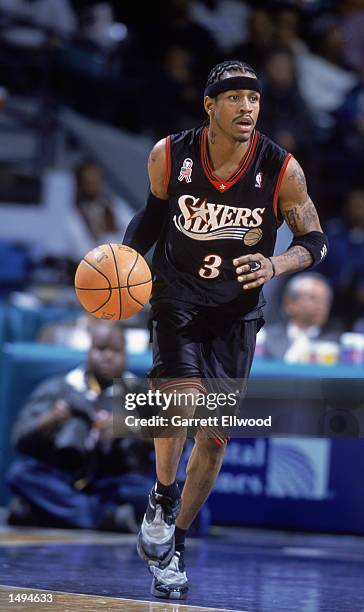 Guard Allen Iverson of the Philadelphia 76ers dribbles the ball during the NBA game against the Charlotte Hornets at Charlotte Colesium in Charlotte,...