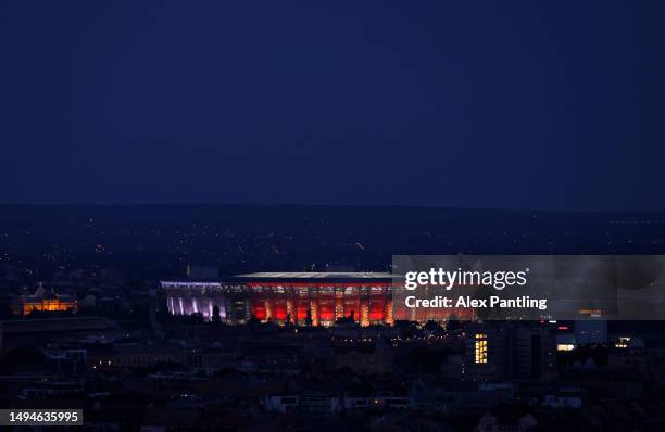 General view as the Puskas Arena lights up in the colours of AS Roma and Sevilla FC prior to the UEFA Europa League 2022/23 final match between...