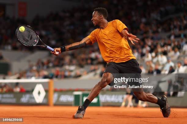 Gael Monfils of France plays a backhand against Sebastian Baez of Argentina during their Men's Singles First Round Match on Day Three of the 2023...