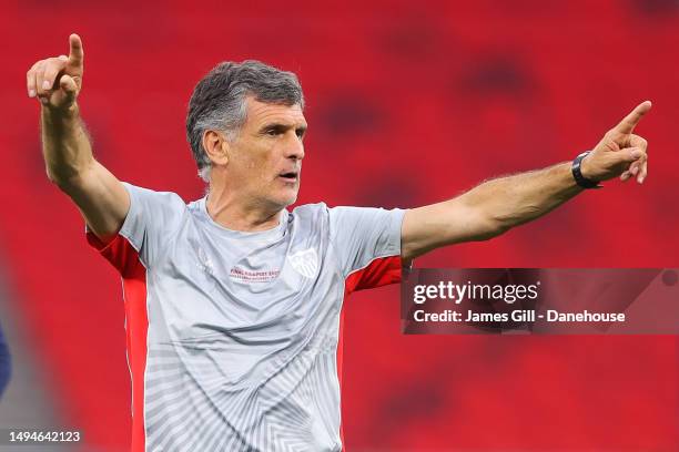 Jose Luis Mendilibar, manager of Sevilla, issues instructions as Sevilla take part in a pre-match training session prior to the UEFA Europa League...