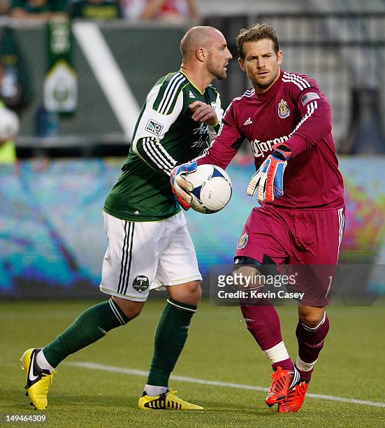 Kris Boyd of the Portland Timbers moves away from Dan Kennedy of Chivas USA in first half action at JELD-WEN Field on July 28, 2012 in Portland,...