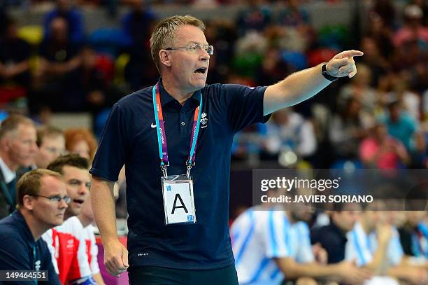 Iceland's coach Gudmundur Gudmundsson gestures during the men's preliminaries Group A handball match Iceland vs Argentina for the London 2012...