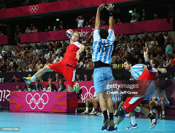 Aron Palmarsson of Iceland jumps to shoot during the Men's Handball Preliminaries Group A match between Iceland and Argentina on Day 2 of the London...